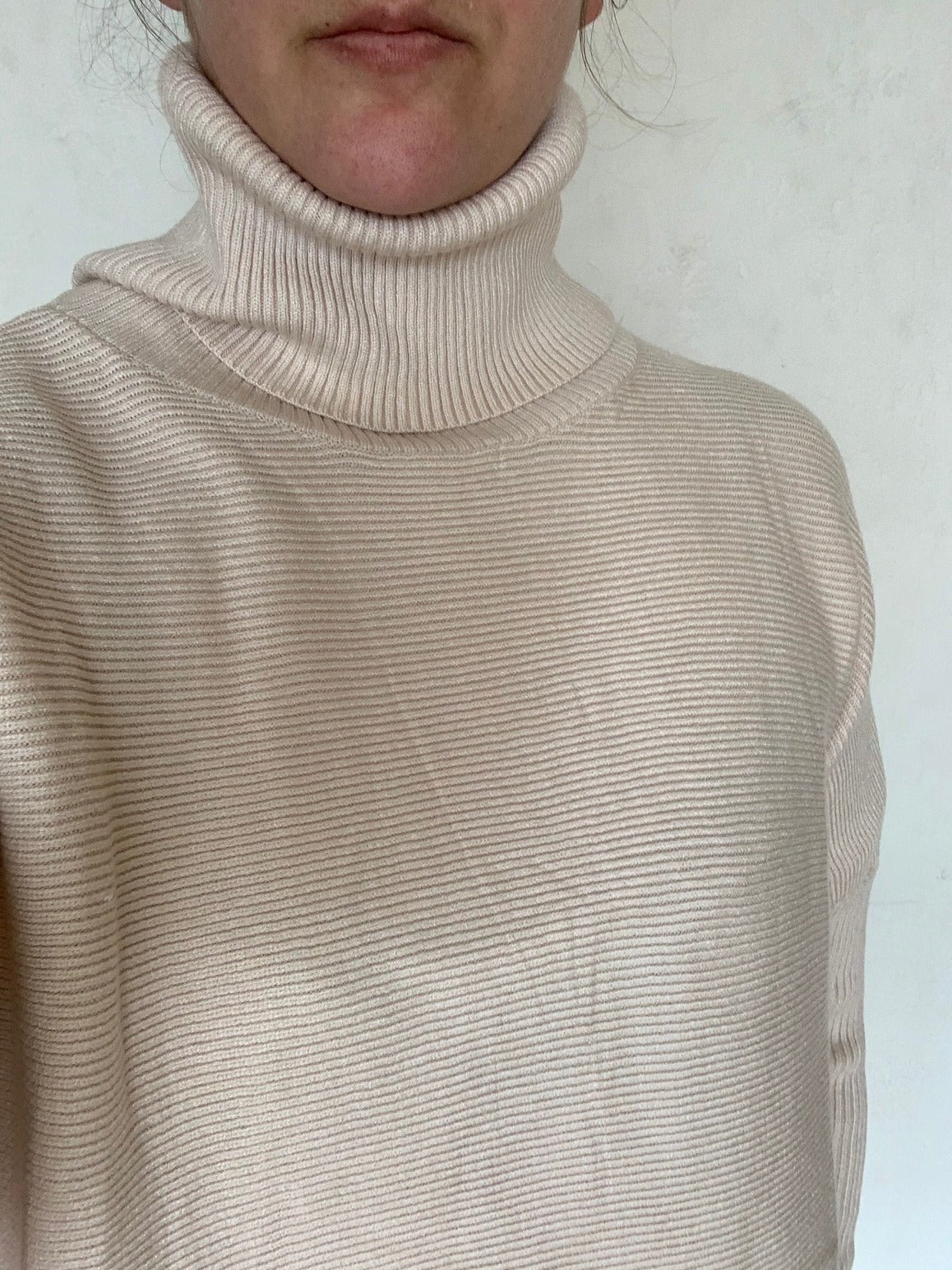 Women's Long Turtleneck Sweater with Asymmetrical Hem